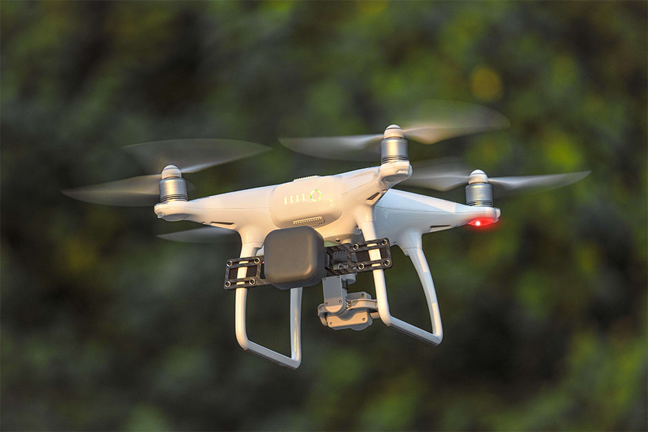 DJI Phantom series drone parachute system deploys during flight.
